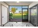 Serene screened patio with a view of manicured lawns and blue skies at 6269 Palma Del Mar S Blvd # 112, St Petersburg, FL 33715