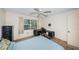 This bedroom features a ceiling fan and a desk by the window at 650 Pinellas Point S Dr # 216, St Petersburg, FL 33705