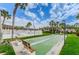 Enjoy the sunny outdoors with well-kept shuffleboard courts, benches, and palm trees in this inviting community recreation area at 650 Pinellas Point S Dr # 216, St Petersburg, FL 33705