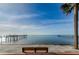 Relax on the bench overlooking serene water views framed by lush palms and charming docks, ideal for peaceful contemplation at 650 Pinellas Point S Dr # 216, St Petersburg, FL 33705