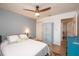Comfortable bedroom with ceiling fan and ample closet space at 6505 Bimini Ct, Apollo Beach, FL 33572