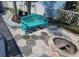 Charming patio with a bright blue bench and a cozy fire pit area at 6505 Bimini Ct, Apollo Beach, FL 33572
