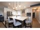 Bright kitchen features an island with seating, stainless steel appliances, and modern finishes for culinary enthusiasts at 6505 Bimini Ct, Apollo Beach, FL 33572
