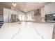 Bright kitchen features an island with seating, stainless steel appliances, and modern finishes for culinary enthusiasts at 6505 Bimini Ct, Apollo Beach, FL 33572
