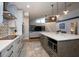 Spacious updated kitchen with quartz countertops, large island and stainless appliances at 6505 Bimini Ct, Apollo Beach, FL 33572