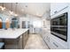 Open kitchen featuring stainless appliances, a large center island with seating and modern fixtures at 6505 Bimini Ct, Apollo Beach, FL 33572