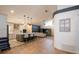 Open-concept living room and kitchen with island seating; perfect for seamless entertaining and modern living at 6505 Bimini Ct, Apollo Beach, FL 33572