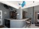 Outdoor patio bar features custom countertops, bar seating, and convenient access to the pool area at 6505 Bimini Ct, Apollo Beach, FL 33572