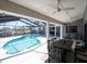 Resort-style screened-in pool and backyard patio offer great space for relaxation and outdoor dining at 6505 Bimini Ct, Apollo Beach, FL 33572