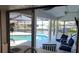 Inviting waterfront view from the indoor bar looking out to the pool and the canal at 6505 Bimini Ct, Apollo Beach, FL 33572