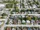 An aerial view shows the neighborhood with tree lined streets at 7014 Westcott Dr, Port Richey, FL 34668