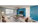 Staged living room boasts plush seating, modern decor, and a large flat-screen TV at 7014 Westcott Dr, Port Richey, FL 34668