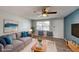 Staged living room with comfortable seating, modern decor, and natural light at 7014 Westcott Dr, Port Richey, FL 34668