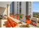 Spacious balcony with dining set, potted plants, and views of surrounding buildings at 750 4Th Avenue South # 601H, St Petersburg, FL 33701