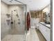 Bathroom featuring glass shower, dual sinks, and modern finishes at 750 4Th Avenue South # 601H, St Petersburg, FL 33701