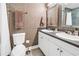 Bathroom featuring double sinks, framed mirror, stylish wallpaper and accents at 750 4Th Avenue South # 601H, St Petersburg, FL 33701