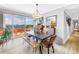 Bright dining area with hardwood floors and a sliding glass door leading to the balcony at 750 4Th Avenue South # 601H, St Petersburg, FL 33701