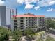 Beautiful multi-story condo building with orange roof, lots of balconies and manicured lawn at 750 4Th Avenue South # 601H, St Petersburg, FL 33701