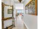Long hallway with light hardwood floors leading to living and dining area with balcony access at 750 4Th Avenue South # 601H, St Petersburg, FL 33701