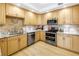 Updated kitchen featuring stainless steel appliances, double oven, and stone countertops at 750 4Th Avenue South # 601H, St Petersburg, FL 33701