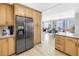 Bright kitchen offers stainless refrigerator and views to open living area at 750 4Th Avenue South # 601H, St Petersburg, FL 33701