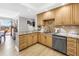 Kitchen showcasing granite counters, stainless dishwasher, and light wood cabinets at 750 4Th Avenue South # 601H, St Petersburg, FL 33701