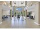 Grand lobby featuring a water feature, high ceilings, tile floors, and seating areas at 750 4Th Avenue South # 601H, St Petersburg, FL 33701