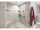 Luxurious walk-in shower with glass enclosure, bench, and elegant tile work and fixtures at 750 4Th Avenue South # 601H, St Petersburg, FL 33701