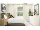 Inviting bedroom with a modern dresser, soft natural light, and elegant furnishings at 7770 Painted Sky Pl, Land O Lakes, FL 34637