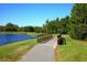 Charming wooden bridge over a pond, adding a touch of rustic elegance to the community's landscape at 7770 Painted Sky Pl, Land O Lakes, FL 34637