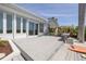 Outdoor deck with seating overlooking lush vegetation and serene setting at 7906 Bayshore Dr, Seminole, FL 33776