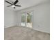 Bright bedroom featuring sliding glass doors leading to outdoor pool area at 7906 Bayshore Dr, Seminole, FL 33776