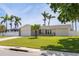 Charming single-story home with well-manicured lawn and fenced yard at 7906 Bayshore Dr, Seminole, FL 33776