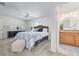 Main bedroom featuring an ensuite bathroom with a wooden vanity at 7906 Bayshore Dr, Seminole, FL 33776