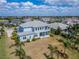 An aerial view shows the home's spacious backyard and the surrounding neighborhood at 814 Manns Harbor Dr, Apollo Beach, FL 33572