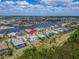 Stunning aerial view of a riverfront home in a tropical neighborhood at 814 Manns Harbor Dr, Apollo Beach, FL 33572