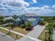 A stunning aerial view showcases the home's landscaped front yard at 814 Manns Harbor Dr, Apollo Beach, FL 33572