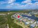 Aerial view of waterfront community featuring beautiful homes, boat docks and nearby ocean views at 814 Manns Harbor Dr, Apollo Beach, FL 33572