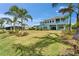 This home includes a large lawn and covered patio that overlooks the beautifully landscaped backyard at 814 Manns Harbor Dr, Apollo Beach, FL 33572