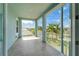 Expansive balcony with white railing provides stunning views of lush landscape, inviting relaxation and outdoor enjoyment at 814 Manns Harbor Dr, Apollo Beach, FL 33572