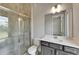 Modern bathroom with a glass-enclosed shower and sleek vanity at 814 Manns Harbor Dr, Apollo Beach, FL 33572