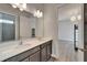 Bathroom vanity with double sinks and modern fixtures at 814 Manns Harbor Dr, Apollo Beach, FL 33572