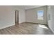 Empty bedroom featuring modern flooring and natural light at 814 Manns Harbor Dr, Apollo Beach, FL 33572