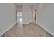 Bedroom featuring hardwood floors and multiple access doors to bathroom at 814 Manns Harbor Dr, Apollo Beach, FL 33572