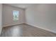 Cozy bedroom with natural light and modern wood-style flooring at 814 Manns Harbor Dr, Apollo Beach, FL 33572