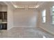 Bright dining room with elegant lighting, marble floors, and modern windows at 814 Manns Harbor Dr, Apollo Beach, FL 33572