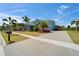 Beautiful two-story home with lush landscaping, long driveway and a three car garage at 814 Manns Harbor Dr, Apollo Beach, FL 33572