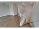 Upstairs hallway featuring hardwood floors, stairway and lots of space at 814 Manns Harbor Dr, Apollo Beach, FL 33572