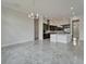 Open-concept kitchen with stainless steel appliances and a breakfast bar at 814 Manns Harbor Dr, Apollo Beach, FL 33572
