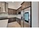 Kitchen with stainless steel refrigerator, granite countertops, and a decorative backsplash at 814 Manns Harbor Dr, Apollo Beach, FL 33572